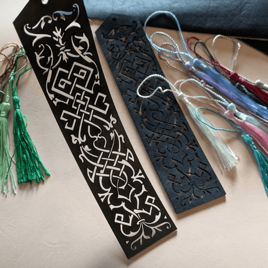 Green and blue leather bookmarks each with ornate cut outs and tassels Elvish Style Leather Bookmarks - Pick your color and your tassel Bookmarks Raven King Crafts
