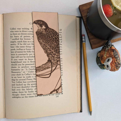 A leather bookmark engraved with the antique art of a falcon. Falcon Bookmark - Leather Bookmarks Raven King Crafts
