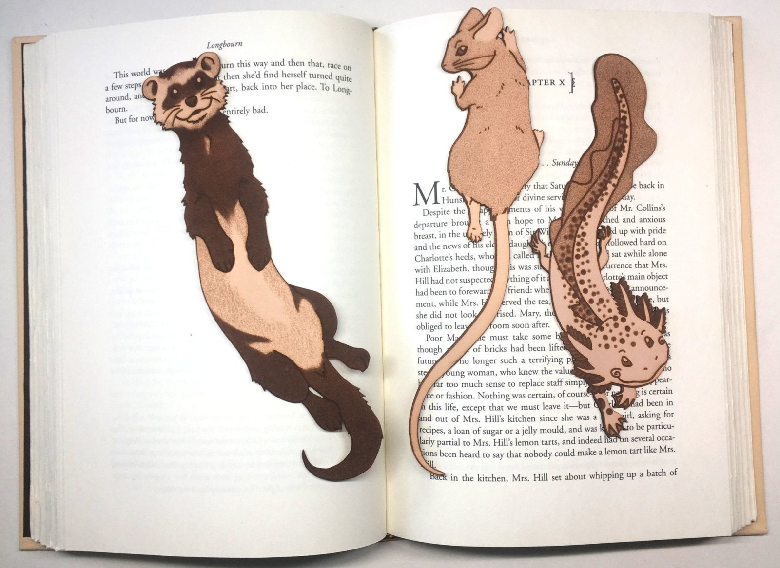 leather bookmarks shaped like a ferret, mouse and axolotl salamander