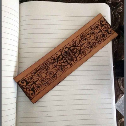 Leather bookmark with a decorative historical floral and iron design engraved on it. Flowers with Iron, Decorative Bookmark Bookmarks Raven King Crafts