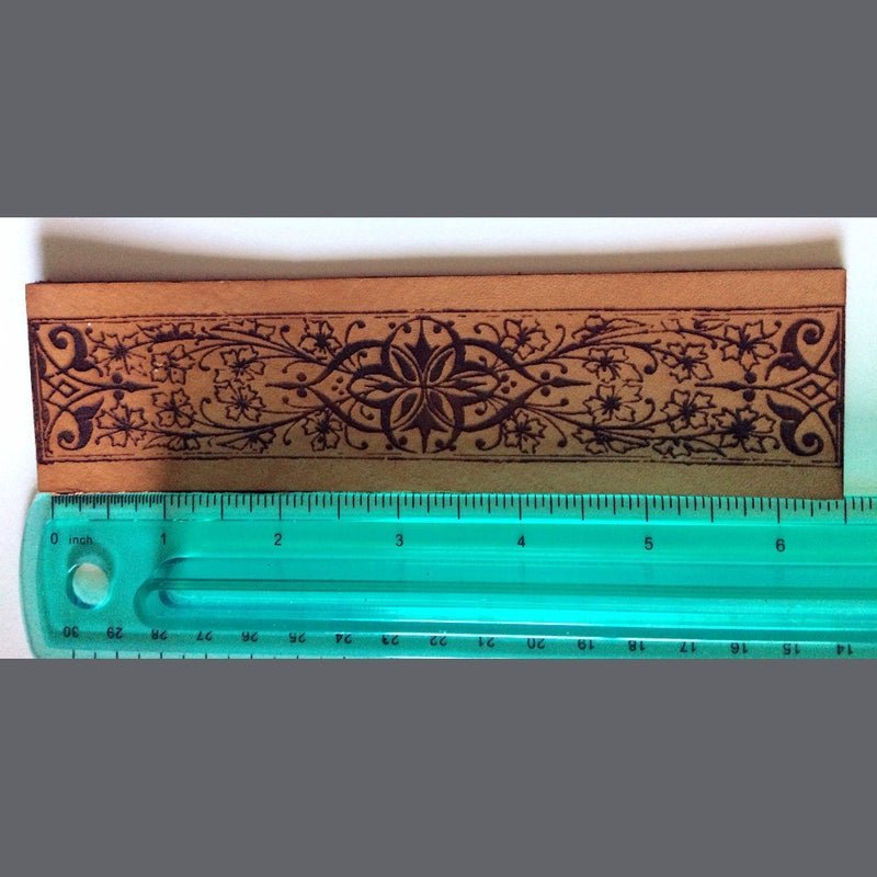 ornate bookmark next to a rulet