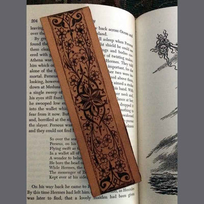 Leather bookmark with a decorative historical floral and iron design engraved on it. Flowers with Iron, Decorative Bookmark Bookmarks Raven King Crafts