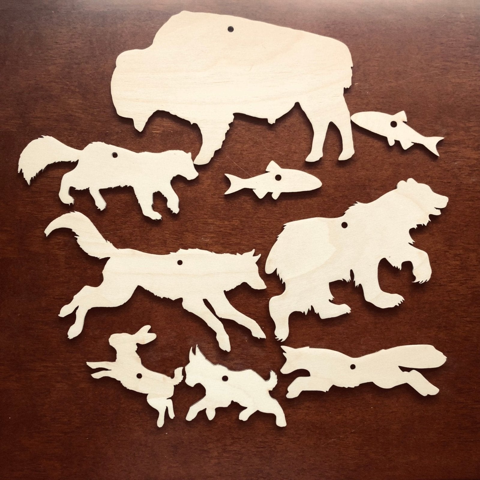 This kit includes: a bison cutout, a bear cutout, a wolverine cutout, a wolf cutout, a fox cutout, a bobcat cutout, a rabbit cutout and 2 fish cutouts.