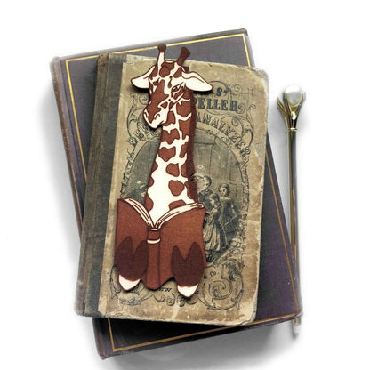 A leather bookmark shaped like a giraffee reading a book. Great Book lover gift. Giraffe Reading Leather Bookmark - Quirky Book-Lover Gift Bookmarks Raven King Crafts