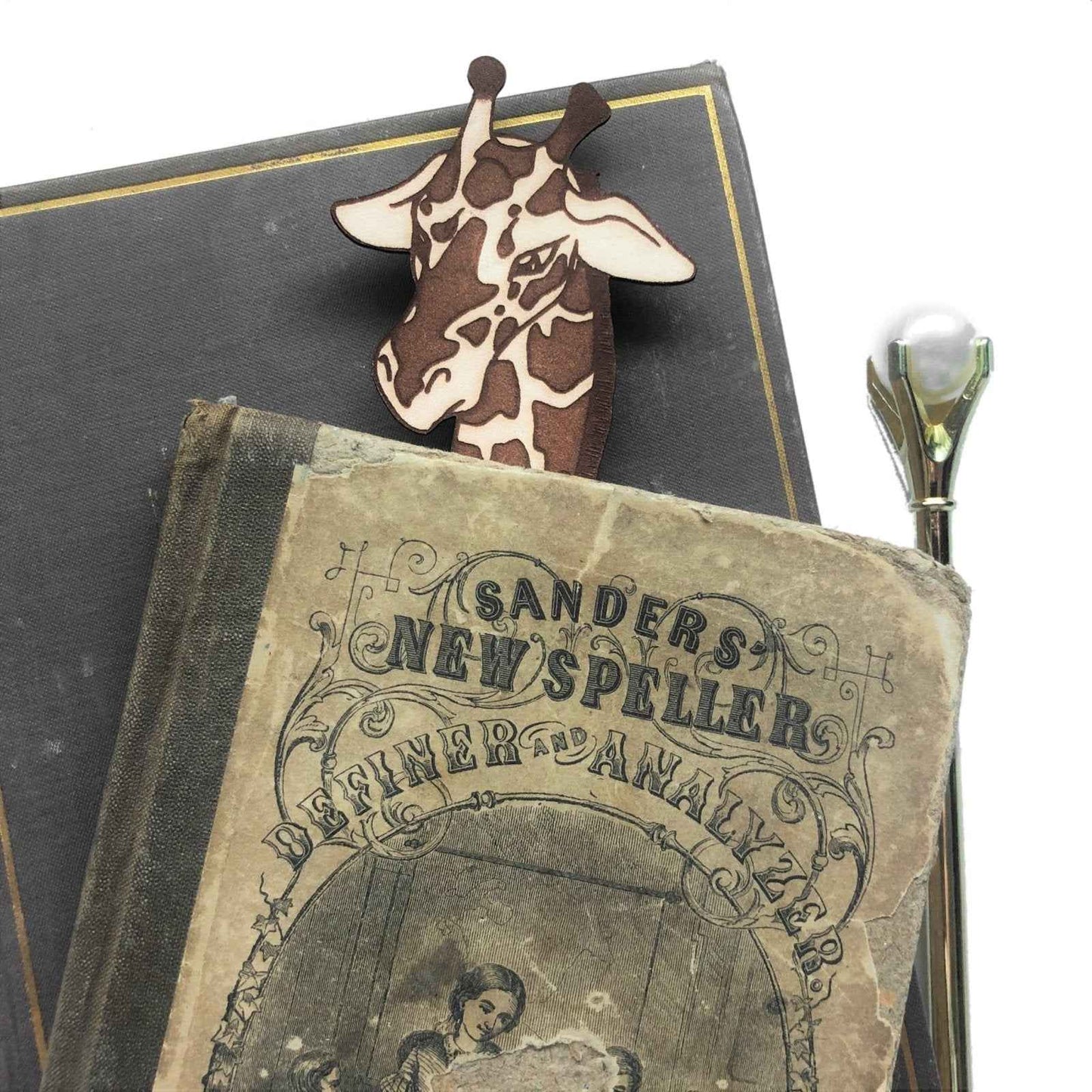 A leather bookmark shaped like a giraffee reading a book. Great Book lover gift. Giraffe Reading Leather Bookmark - Quirky Book-Lover Gift Bookmarks Raven King Crafts
