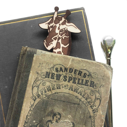 A leather bookmark shaped like a giraffee reading a book. Great Book lover gift. Giraffe Reading Leather Bookmark - Quirky Book-Lover Gift Bookmarks Raven King Crafts