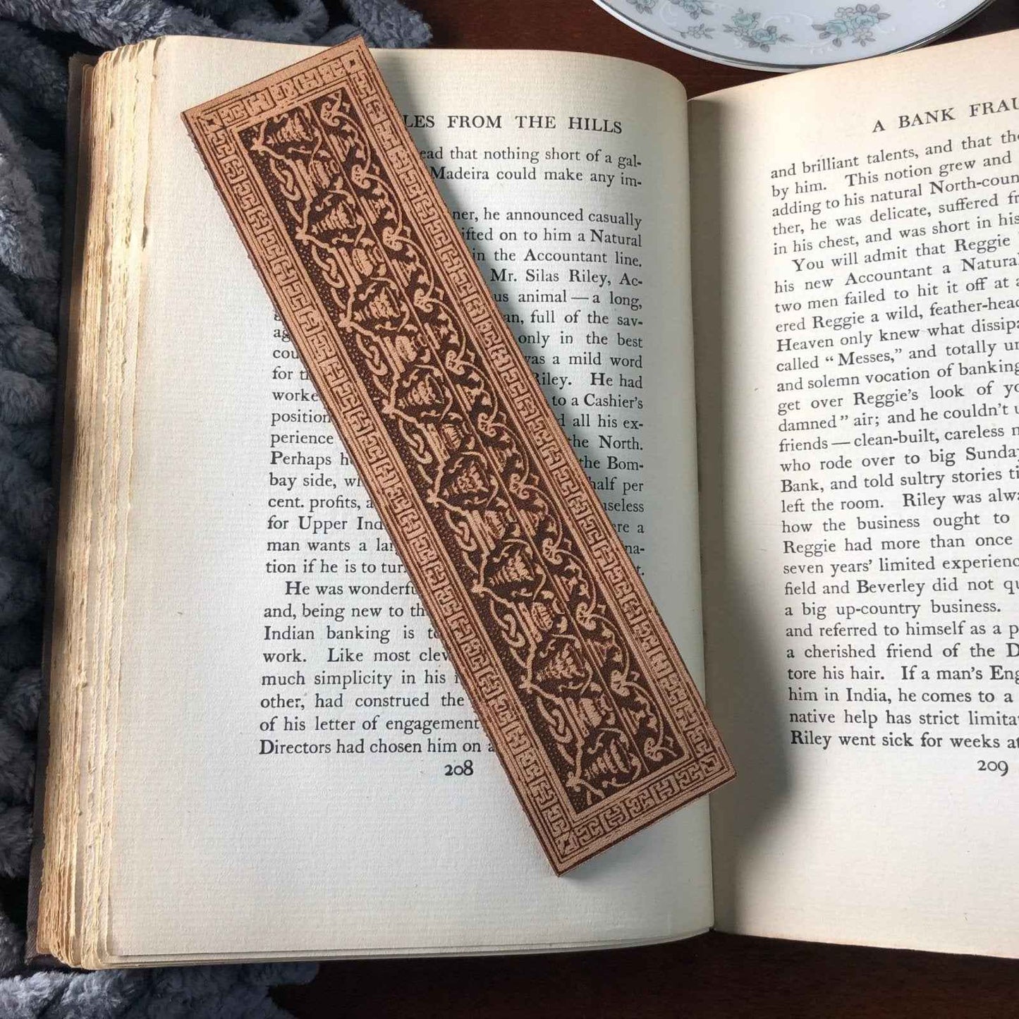 A leather bookmark engraved with the antique decorative art that is either Greek or Roman. Greek or Roman Leather Bookmark Bookmarks Raven King Crafts