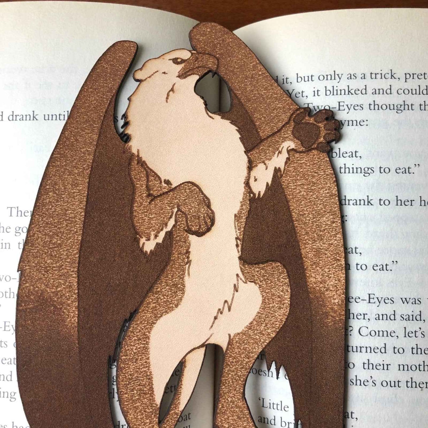 A leather bookmark of a griffin, the mythical beast. Griffin Bookmark - Leather | Wonderful Fantasy Beast Gift Bookmarks Raven King Crafts