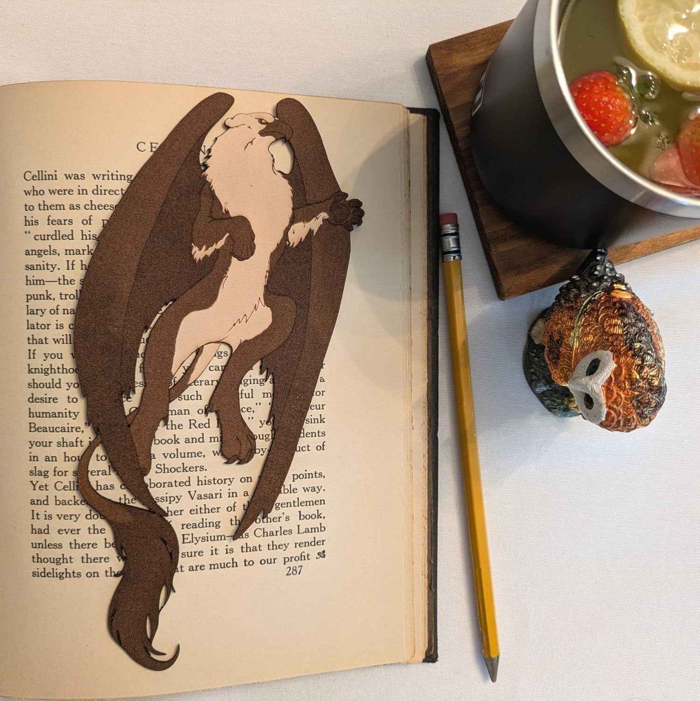 A leather bookmark shaped like a gryhpon. Griffin Bookmark - Leather | Wonderful Fantasy Beast Gift Bookmarks Raven King Crafts