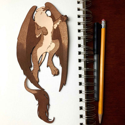 A leather bookmark shaped like the mythical beast the griffin. Griffin Bookmark - Leather | Wonderful Fantasy Beast Gift Bookmarks Raven King Crafts