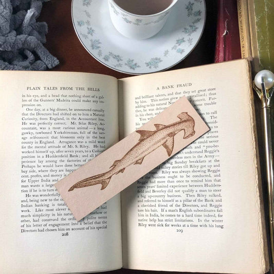 A leather bookmark engraved with the art of a hammerhead shark. Hammerhead Shark Bookmark Bookmarks Raven King Crafts