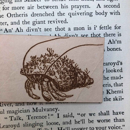 A leather bookmark engraved with the antique art of hermit crabs. Hermit Crabs Bookmark Bookmarks Raven King Crafts