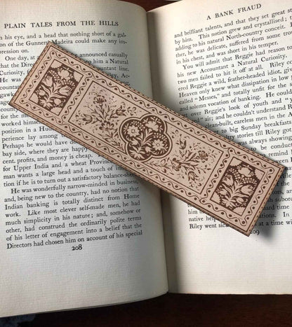 A leather bookmark engraved with the antique floral art. Historical Floral Leather Bookmark Bookmarks Raven King Crafts