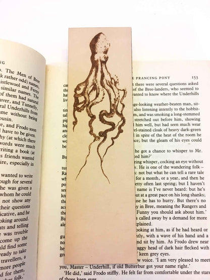 A leather bookmark with the antique art of an octopus on it. Historical Octopus Bookmark Bookmarks Raven King Crafts