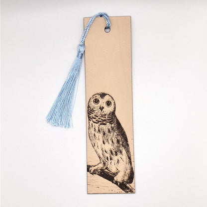 The barred owl bookmark with a light blue tassel.