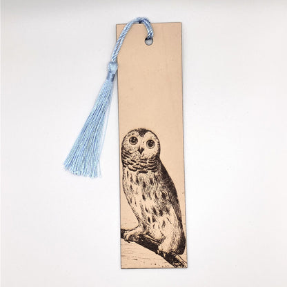 The barred owl bookmark with a light blue tassel. Juvenile Barred Owl Bookmark - Leather Bookmarks Raven King Crafts