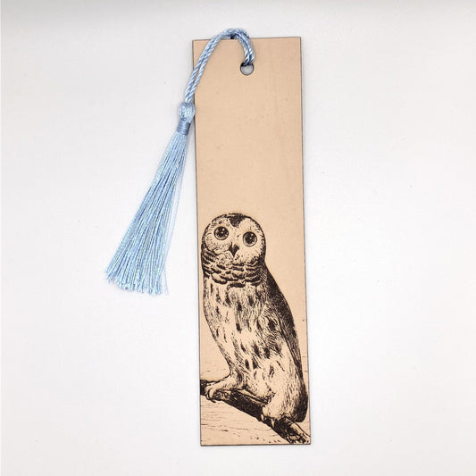 The barred owl bookmark with a light blue tassel. Juvenile Barred Owl Bookmark - Leather Bookmarks Raven King Crafts
