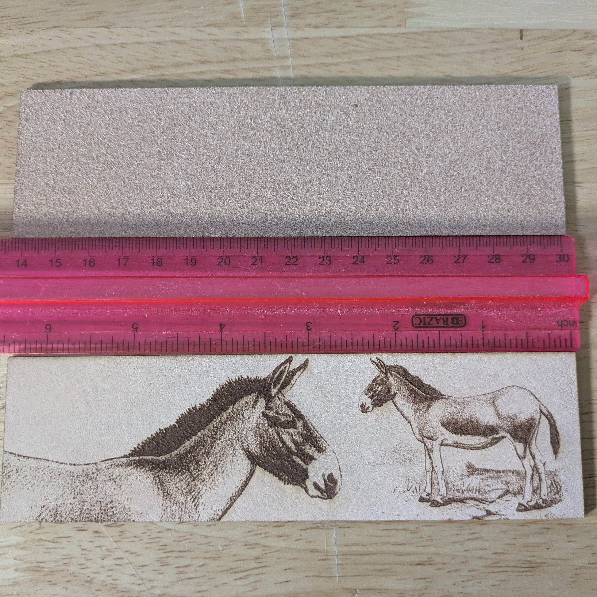 Tibetan wild donkey bookmark next to a ruler. Kiang of Tibet - Leather Bookmark Bookmarks Raven King Crafts
