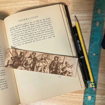 A leather bookmark engraved with the antique art of King Arthur and his knights. King with Knights Bookmark Bookmarks Raven King Crafts