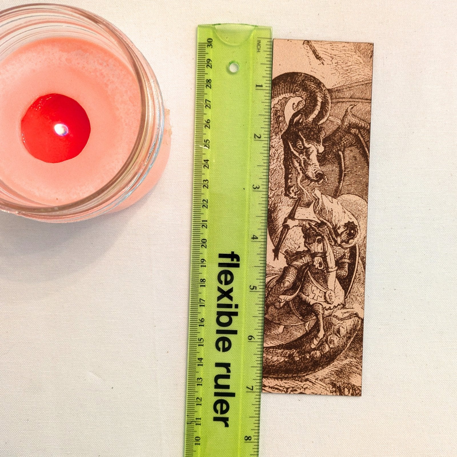 The dragon and knight fighting dragons next to a ruler to show scale. Knight Fighting a Dragon - Leather Historical Bookmark Bookmarks Raven King Crafts