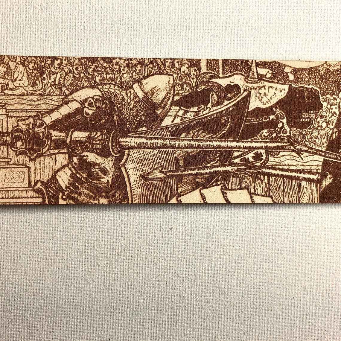 A leather bookmark engraved with the antique art of knights jousting. Knights Jousting Leather Bookmark Bookmarks Raven King Crafts
