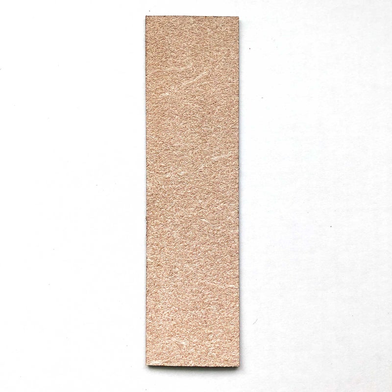 A photograph of the back of a leather bookmark. The back is a rougher pattern but isn't scratchy or unpleasant.