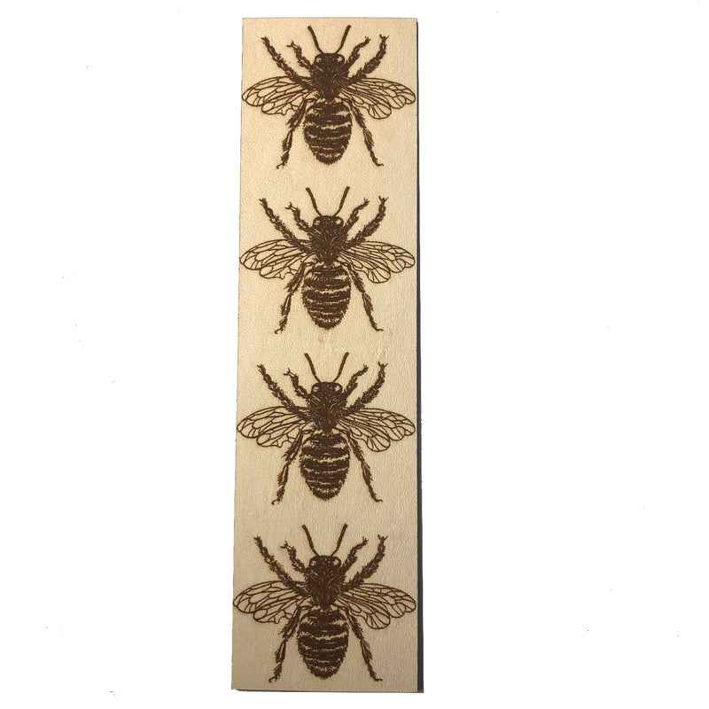 A leather bookmark with the antique art of bees engraved on it. Leather Bee Bookmark Bookmarks Raven King Crafts