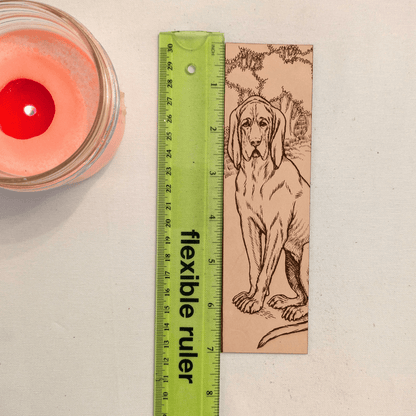 The leather bloodhound bookmark next to a ruler to show scale. Leather Bloodhound Bookmark (Houd dog) Bookmarks Raven King Crafts Leather Bloodhound Bookmark (Hound dog) Bookmarks Raven King Crafts