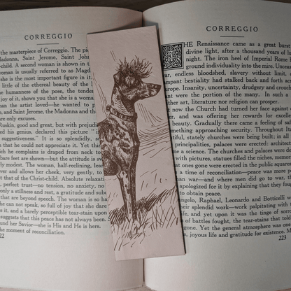 A rectangular leather bookmark with the historical art of an Chinese Crested dog engraved on it. The bookmark is resting on the pages of an open book. Leather Chinese Crested Dog Bookmark Bookmarks Raven King Crafts Leather Chinese Crested Dog Bookmark Bookmarks Raven King Crafts