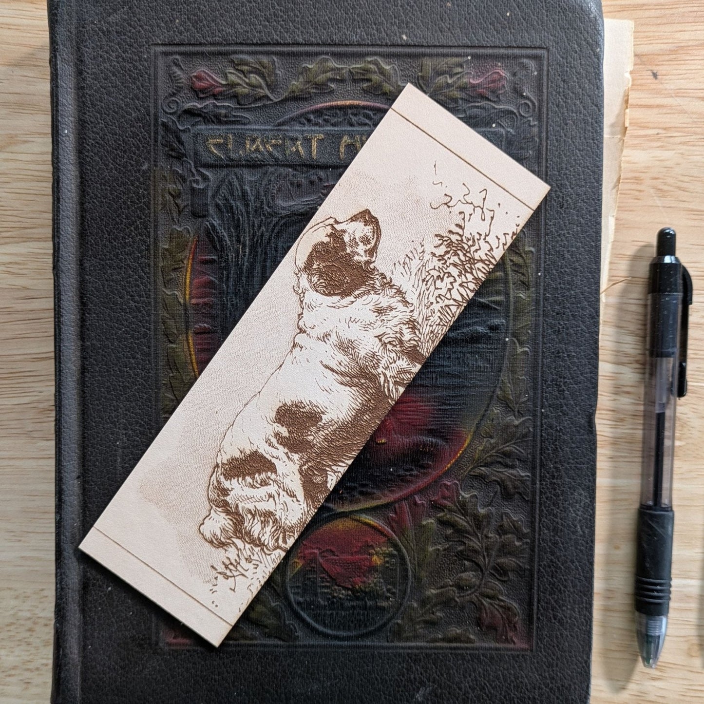 A rectangular leather bookmark with the historical art of a Clumber Spaniel dog engraved on it. Leather Clumber Spaniel Dog Bookmark Bookmarks Raven King Crafts Leather Clumber Spaniel Dog Bookmark Bookmarks Raven King Crafts