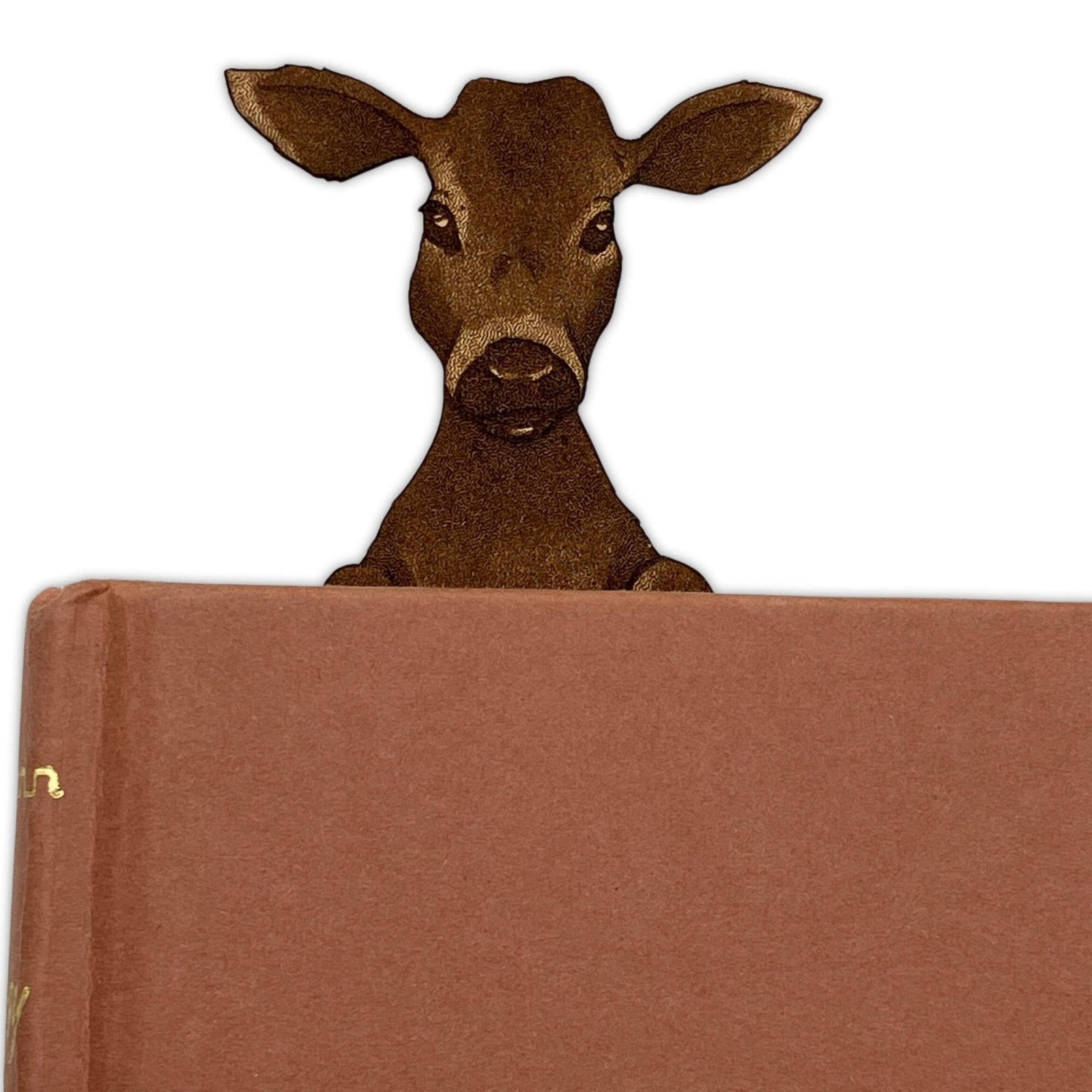 Leather calf bookmark poking out of a book. Leather Cow & Calf Bookmark - Personalize Option Bookmarks Raven King Crafts