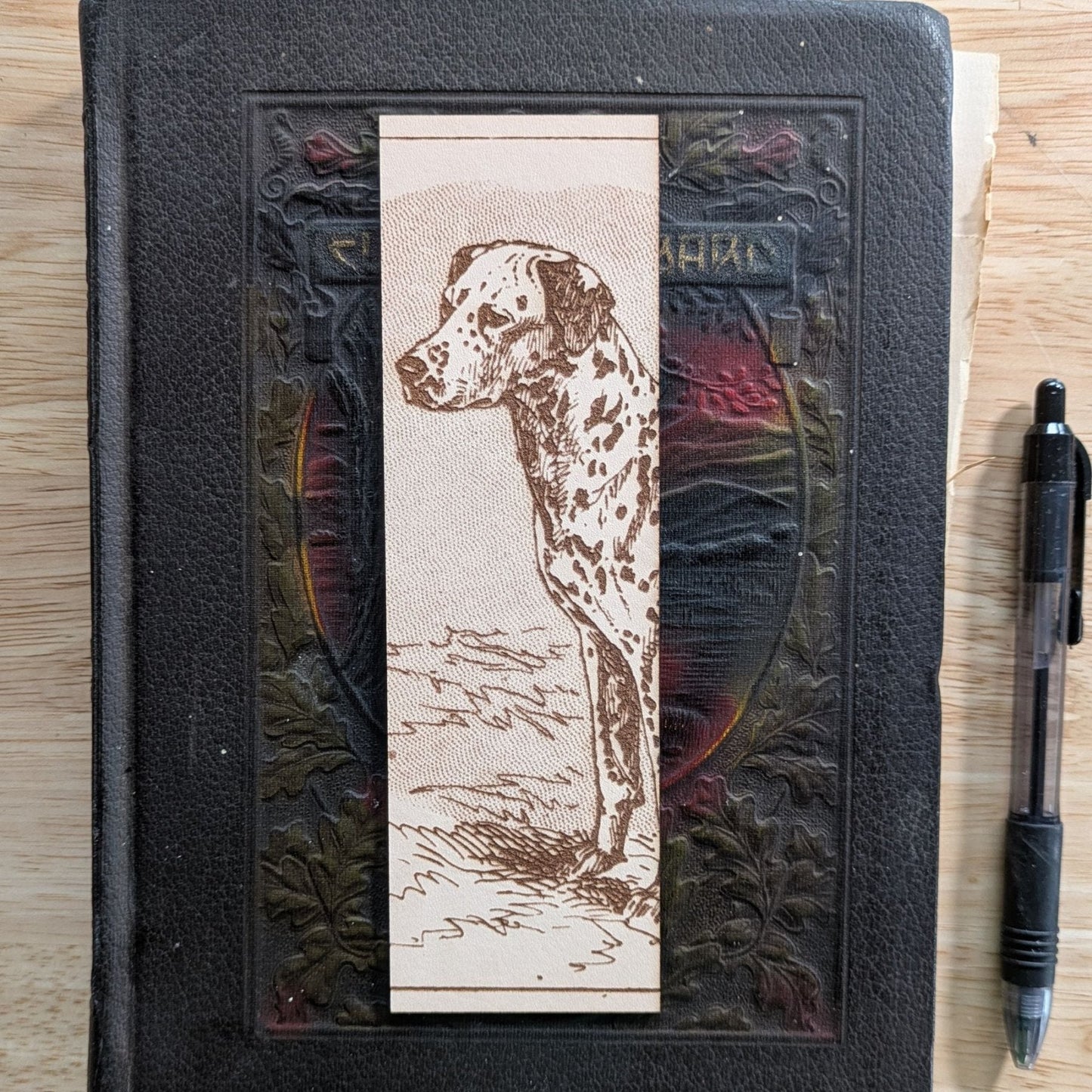 A rectangular leather bookmark with the historical art of a Dalmatian dog engraved on it. Leather Dalmation Dog Bookmarks Bookmarks Raven King Crafts Leather Dalmatian Dog Bookmarks Bookmarks Raven King Crafts