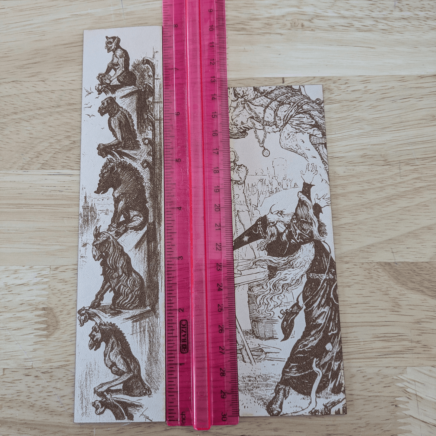 The leather wizard bookmark and gargoyle bookmark next to a ruler for scale. Leather Engraved Gargoyles Bookmark