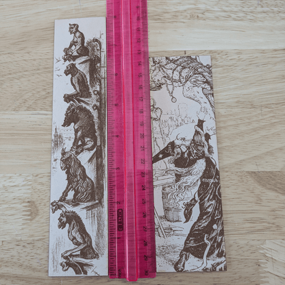 The leather wizard bookmark and gargoyle bookmark next to a ruler for scale. Leather Engraved Gargoyles Bookmark