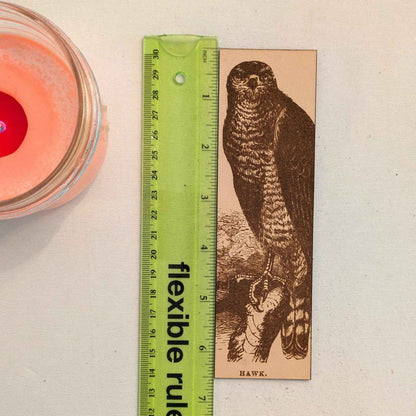 A leather bookmark engraved with the antique art of a hawk. Leather Hawk Bookmark Bookmarks Raven King Crafts