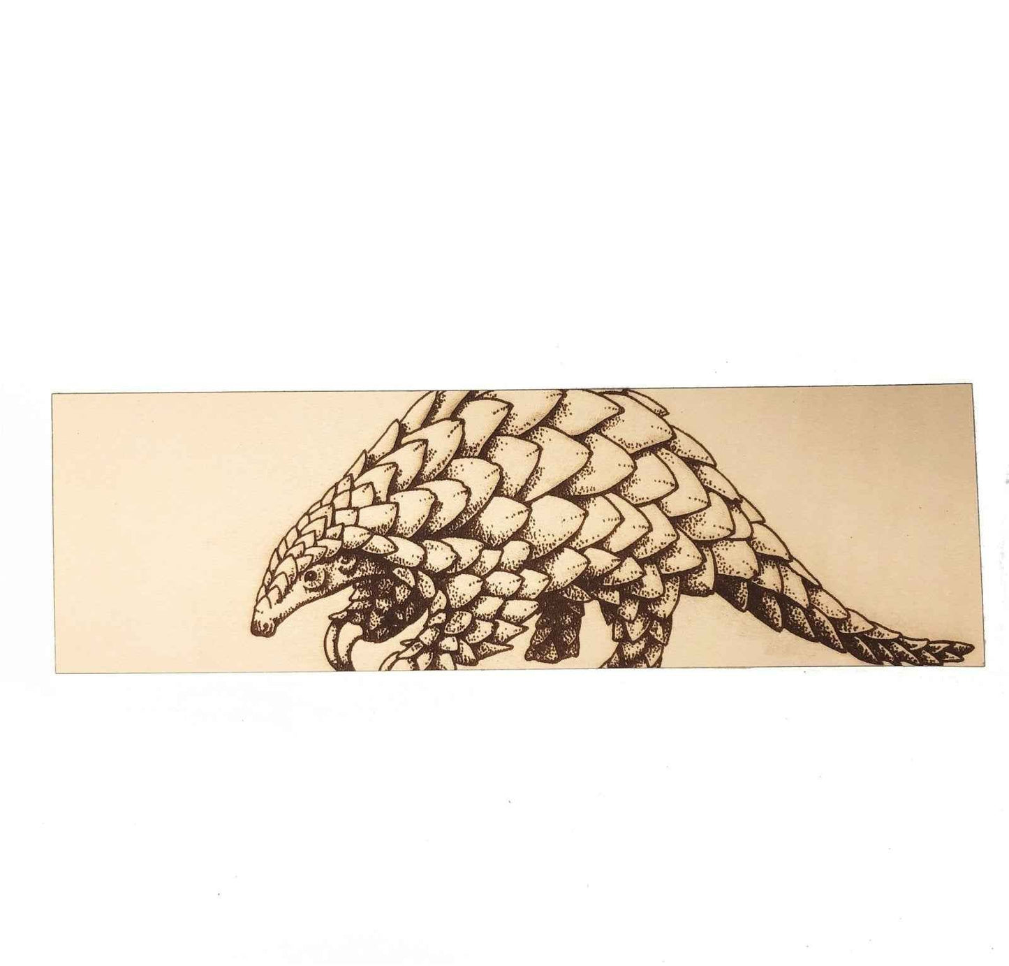 This leather bookmark is engraved with the liscened art of a pangolin on it. Leather Pangolin Bookmark Bookmarks Raven King Crafts