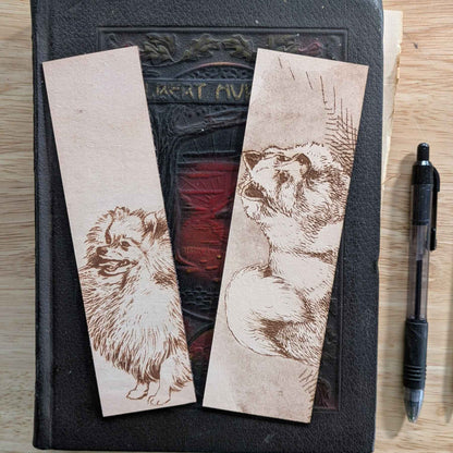 These leather bookmarks are engraved with the art of a pomeranian dog on it. Leather Pomeranian Bookmark Bookmarks Raven King Crafts