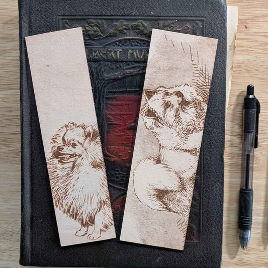 These leather bookmarks are engraved with the art of a pomeranian dog on it. Leather Pomeranian Bookmark Bookmarks Raven King Crafts