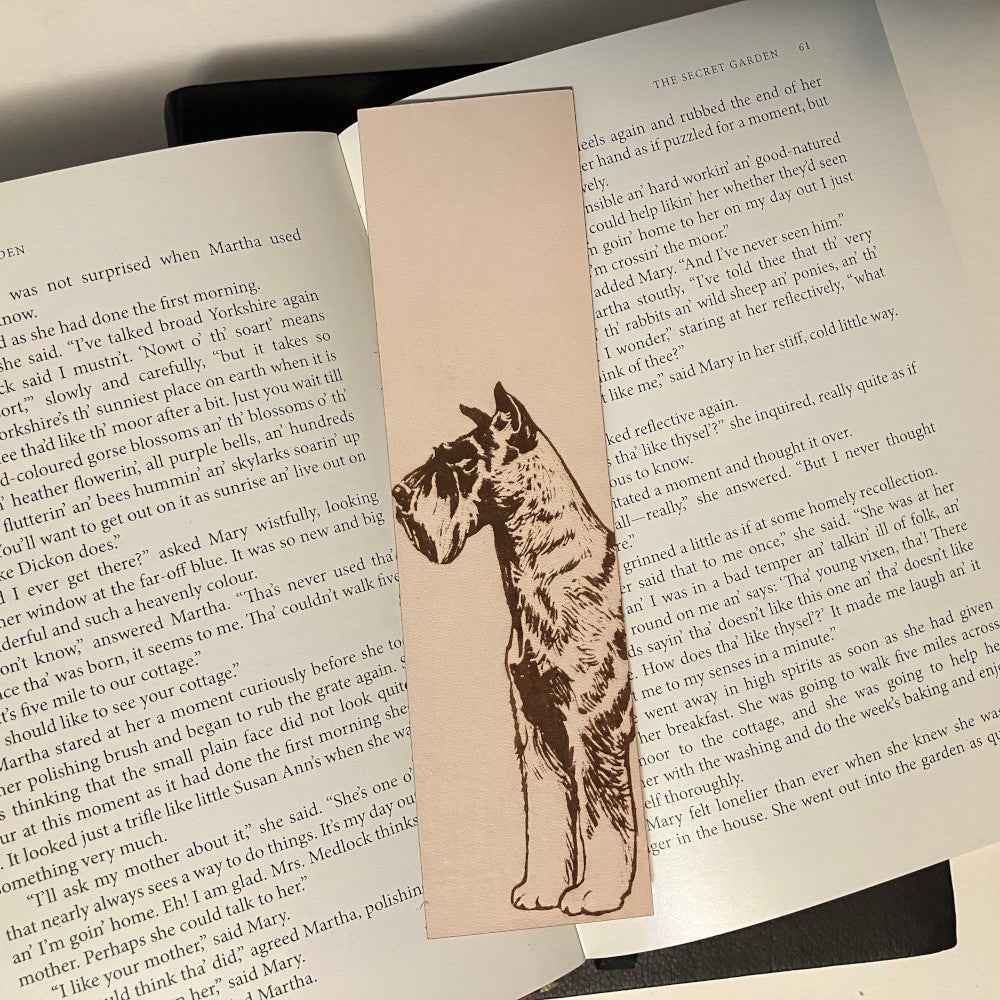 This leather bookmark is engraved with the art of a Schnauzer dog on it. Leather Schnauzer Bookmark Bookmarks Raven King Crafts