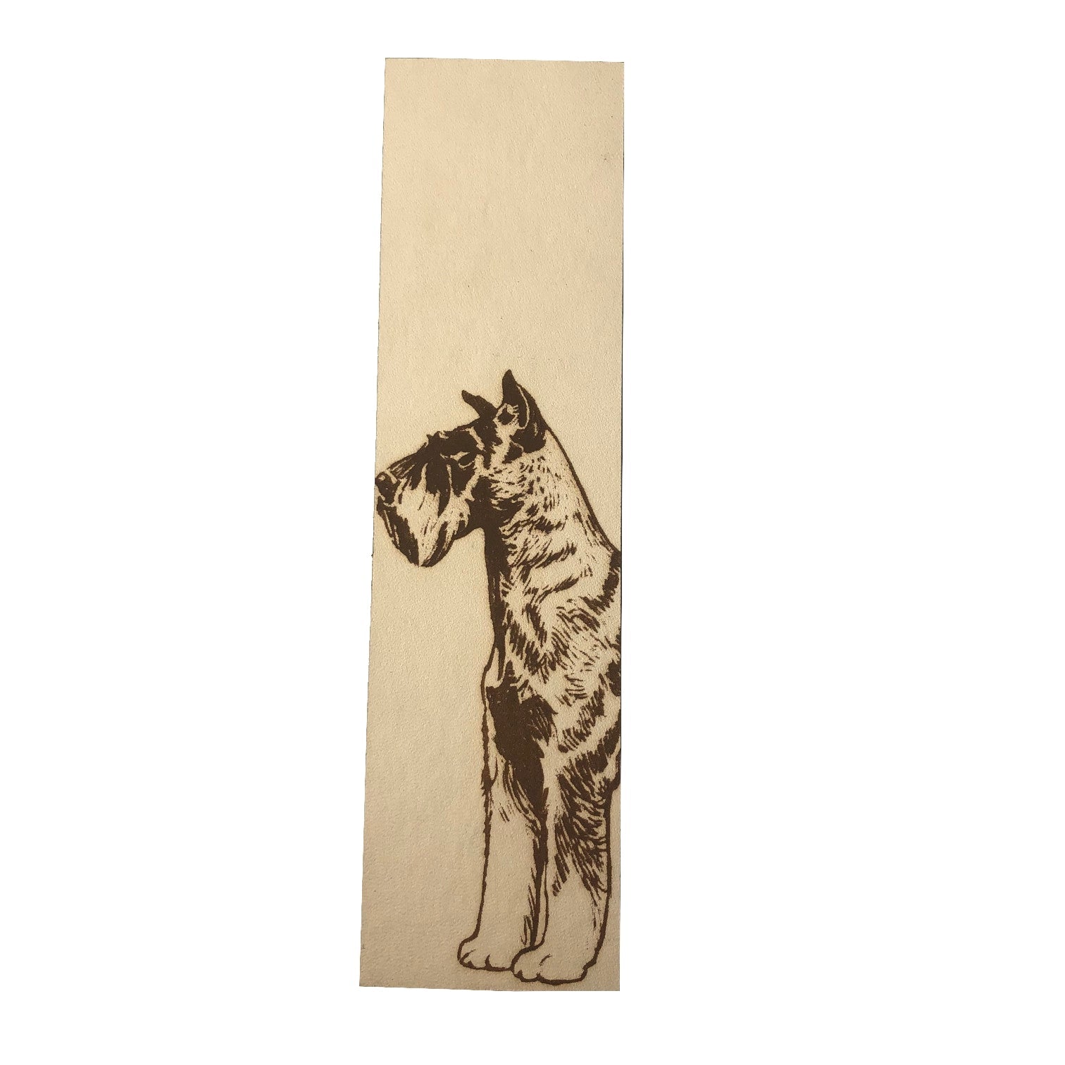 A leather rectangular shaped bookmark with the art of a Schnauzer engraved on it.