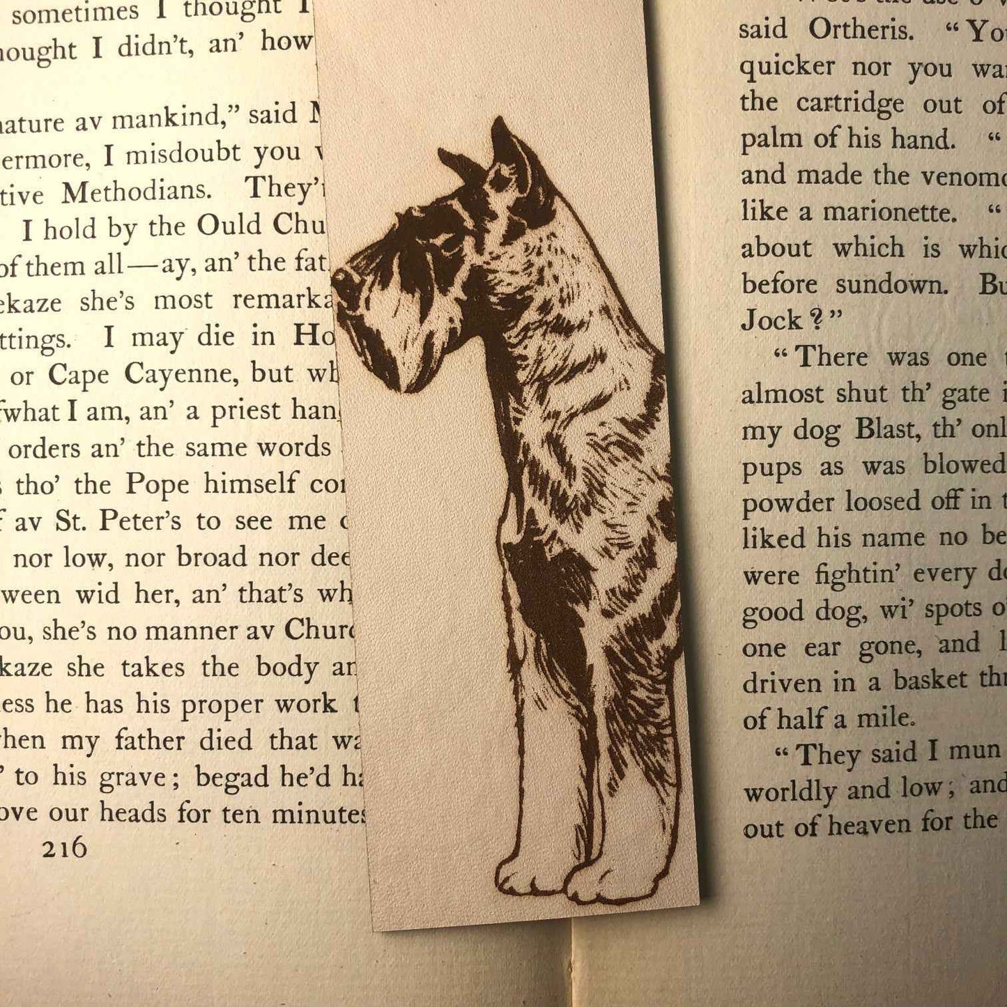 This leather bookmark is engraved with the art of a Schnauzer dog on it. Leather Schnauzer Bookmark Bookmarks Raven King Crafts