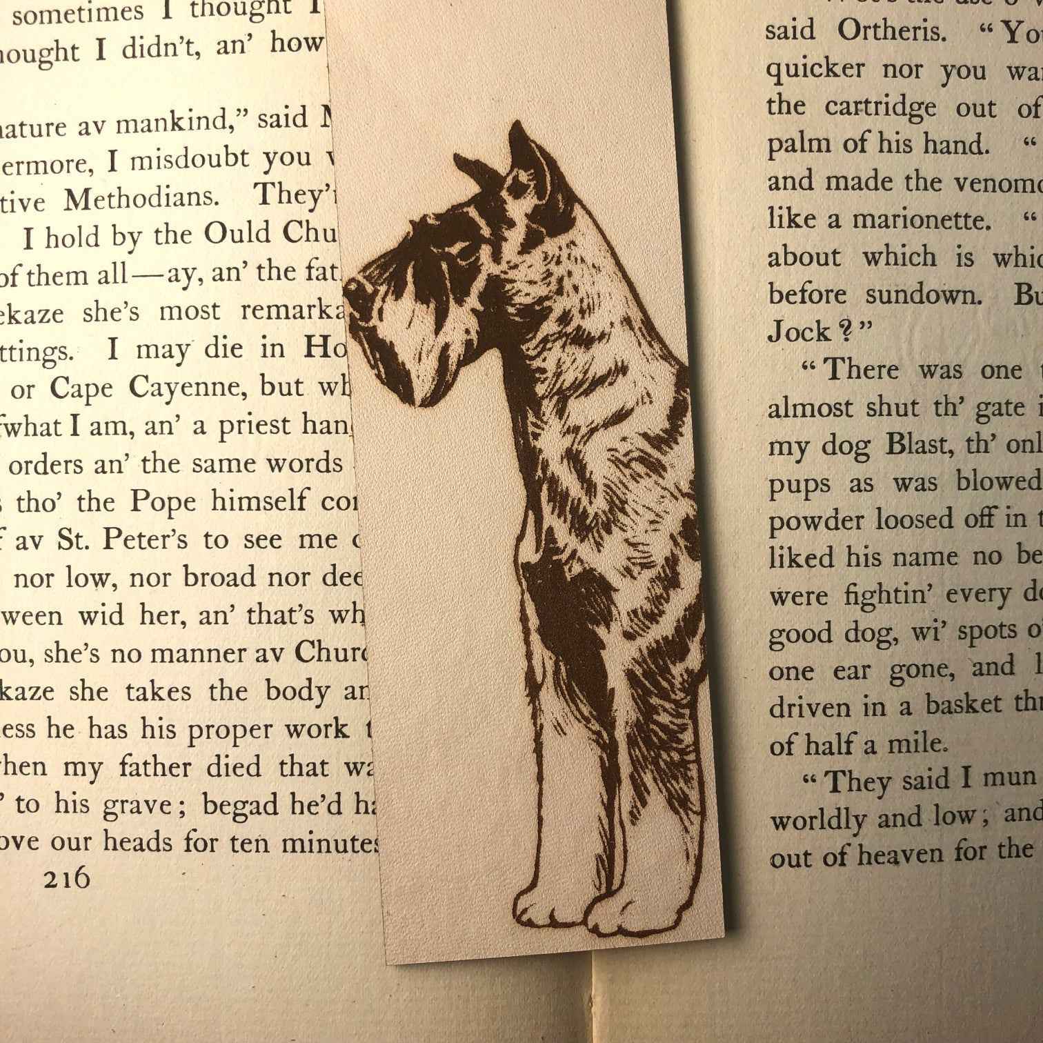 This leather bookmark is engraved with the art of a Schnauzer dog on it. Leather Schnauzer Bookmark Bookmarks Raven King Crafts