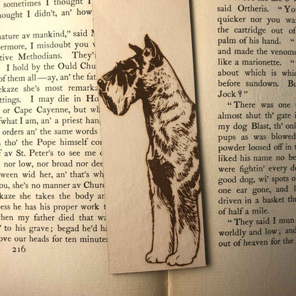 This leather bookmark is engraved with the art of a Schnauzer dog on it. Leather Schnauzer Bookmark Bookmarks Raven King Crafts