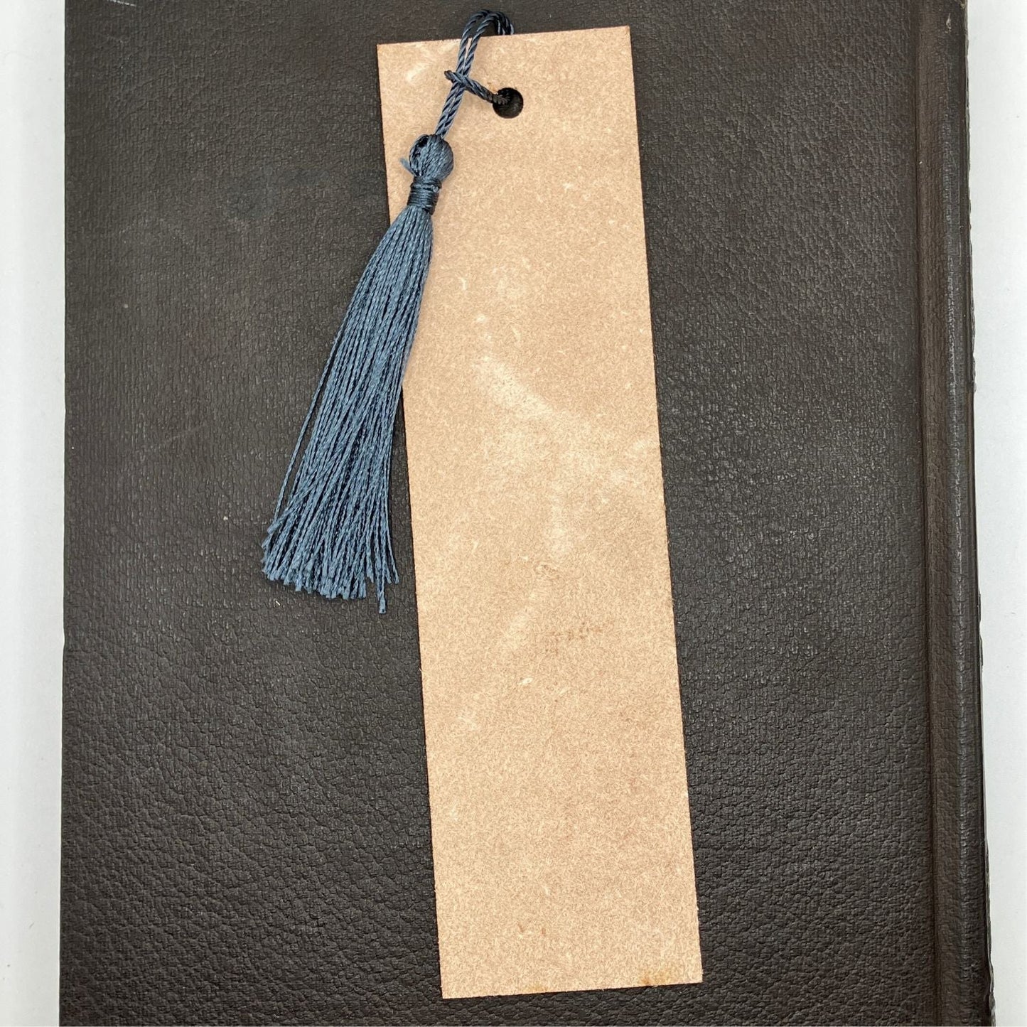 The backs of the leather bookmarks are unfinished and you can see the leather grain. Leather Ship Bookmark Bookmarks Raven King Crafts