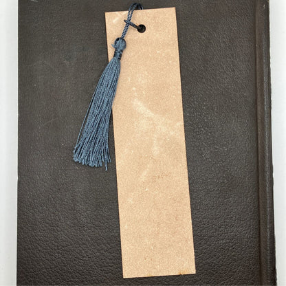 The backs of the leather bookmarks are unfinished and you can see the leather grain. Leather Ship Bookmark Bookmarks Raven King Crafts