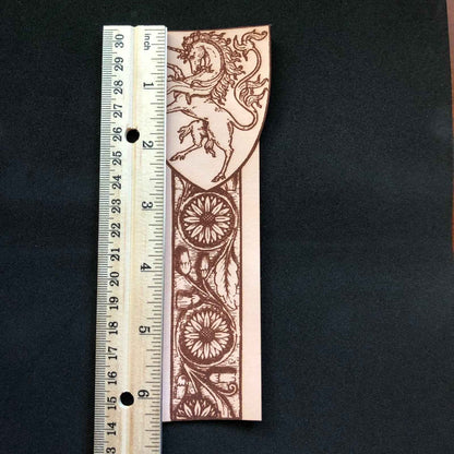A leather bookmark engraved with the antique art of a unicorn. Leather Unicorn Bookmark Bookmarks Raven King Crafts