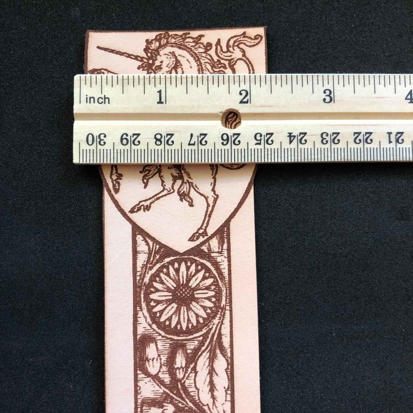 A leather bookmark engraved with the antique art of a unicorn. Leather Unicorn Bookmark Bookmarks Raven King Crafts