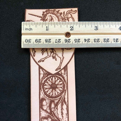 A leather bookmark engraved with the antique art of a unicorn. Leather Unicorn Bookmark Bookmarks Raven King Crafts