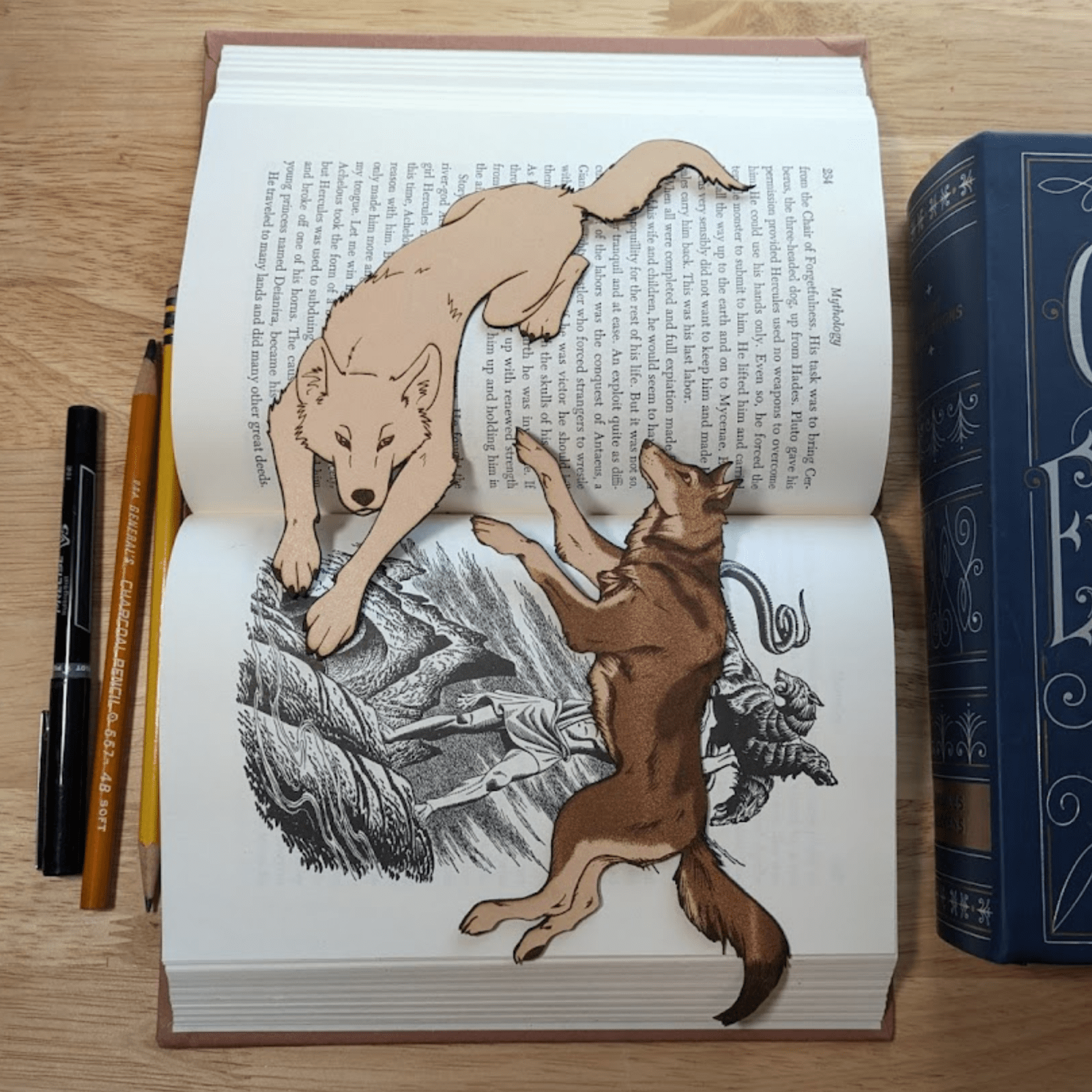 A photograph of both wolf bookmarks. Leather Wolf Bookmark Bookmarks Raven King Crafts Leather Wolf Bookmark - Unique Book Guardian for Book Lovers Bookmarks Raven King Crafts