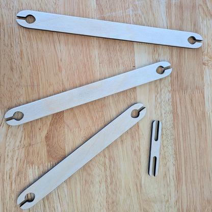 A set of 4 wooden shuttle sticks.
